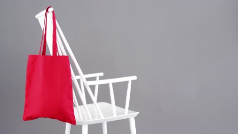 handbag hanging on a chair