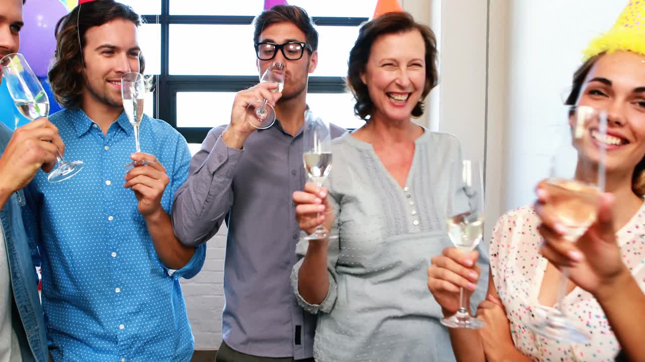 Businesspeople toasting glasses of wine