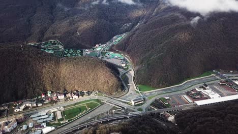 aerial view of a mountainous city with resort and sports facilities