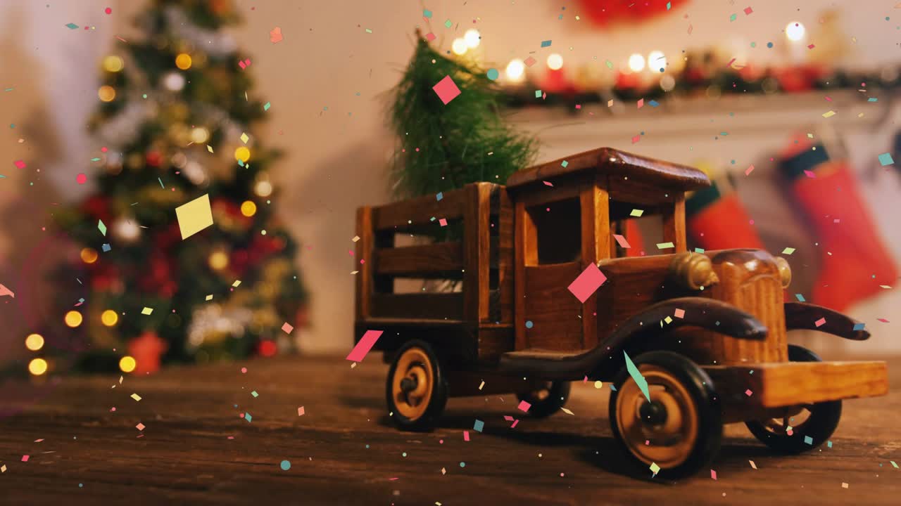 Confetti drifting across tabletop sparking toy truck carrying fir tree rolling right adding cheer