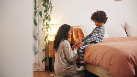 mother and son in bedroom