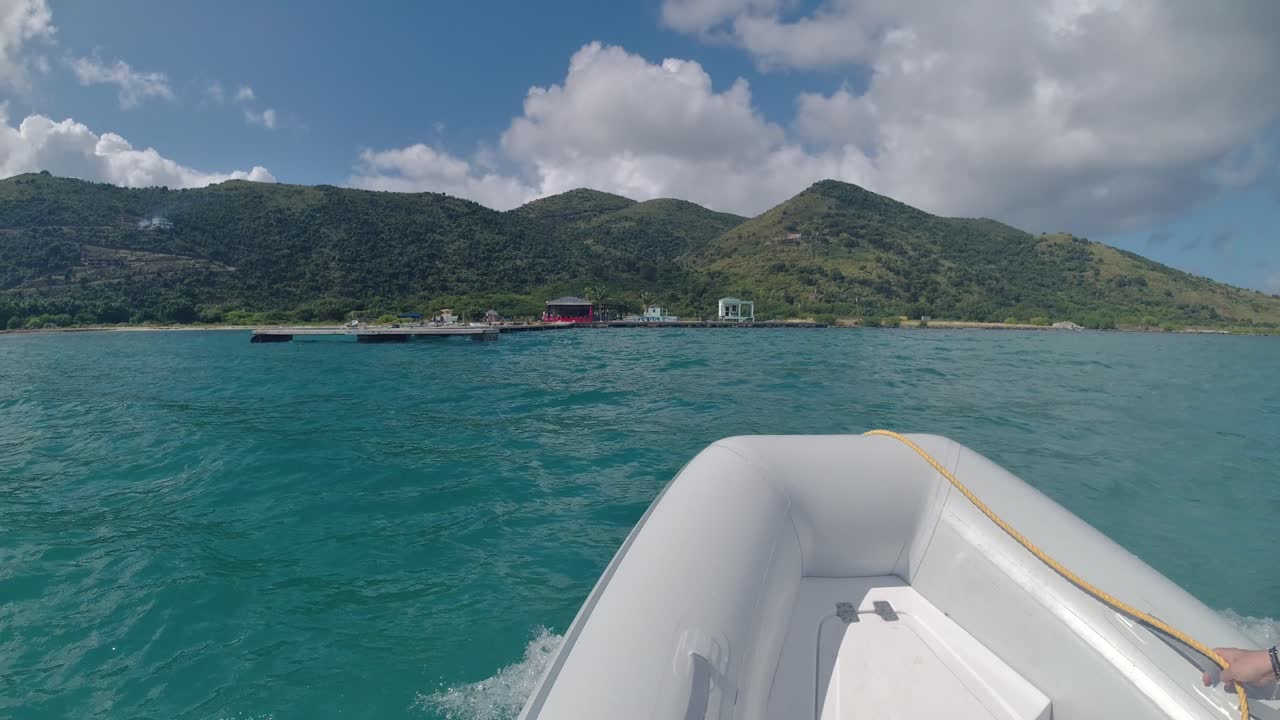 Dinghy going to shore on Jost Van Dyke island in the British Virgin Islands from Diamond Cay. yachters transportation to Bubbly Pool and Foxy's Taboo that was rebuilt after the hurricane