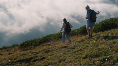 two hikers in mountains with mist