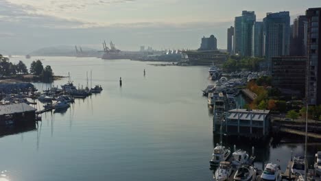 Drone-Aerial-Fly-Back-Shot-At-the-Vancouver-Marina,-British-Columbia,-Canada