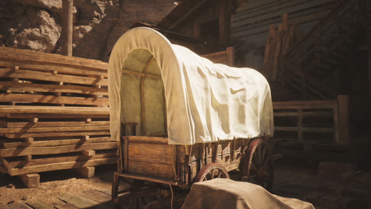 A vintage wagon under a canvas cover in a rustic western setting