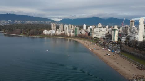 Various-drone-shots-at-English-Bay-near-downtown-Vancouver,-BC-during-Polar-Bear-2019-event