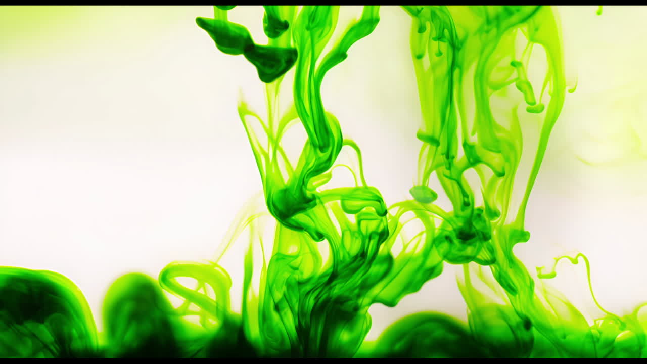 Vibrant Green Liquid Spreading in Water