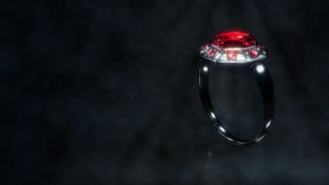 anillo de metal oscuro brillante con joya de rubí roja girar, fictício - video de bucle