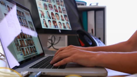 Animation-of-speech-bubble,-cropped-hands-of-biracial-woman-working-on-laptop-and-receiving-phone