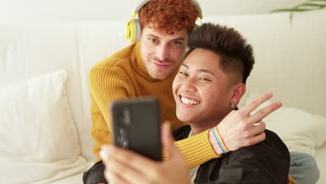 happy couple taking selfies together at home