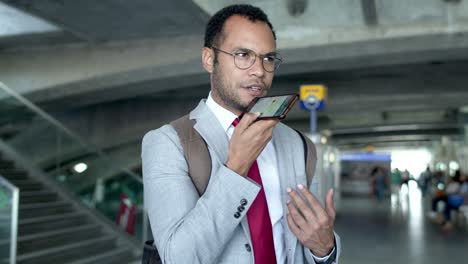 Serious-businessman-talking-by-mobile-phone