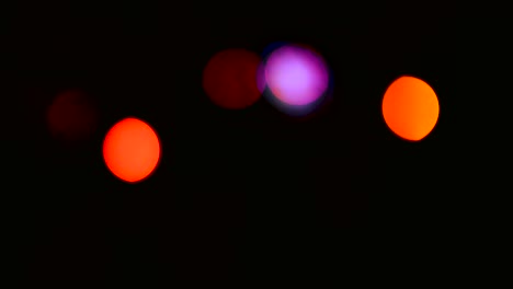 Blurry-defocused-view-of-bokeh-lights-at-stage