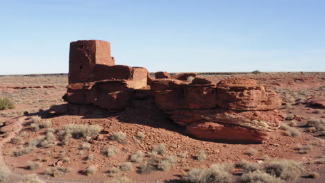 aerial parallax with wukoki pueblo ruins in the desert