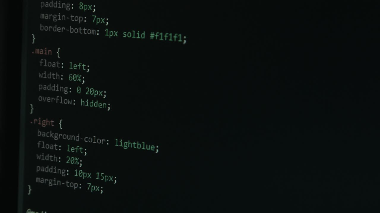 Close Up Code Screen with Different Colours and Cursor Navigating Website with Pixel Details HTML - Focus Pull Footage