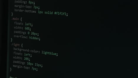 close up code screen with different colours and cursor navigating website with pixel details html - focus pull footage