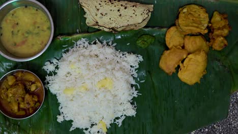 indian-traditional-launch-served-at-banana-leaf-at-home-form-top-angle