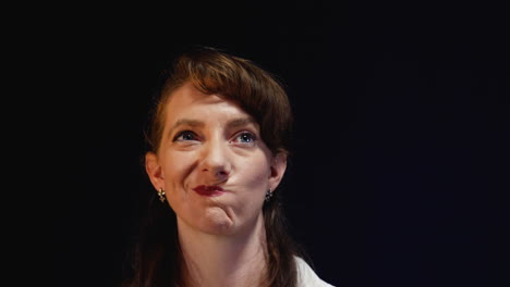 young professional woman waits nervously for an interview.