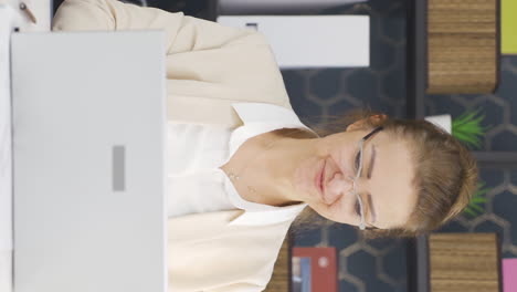 Vertical-video-of-Positive-business-woman-closes-paperwork-files.