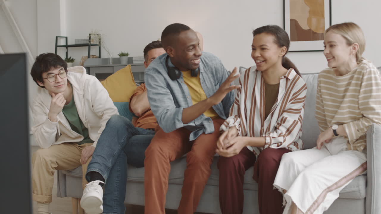 African Man Joining Friends on Couch