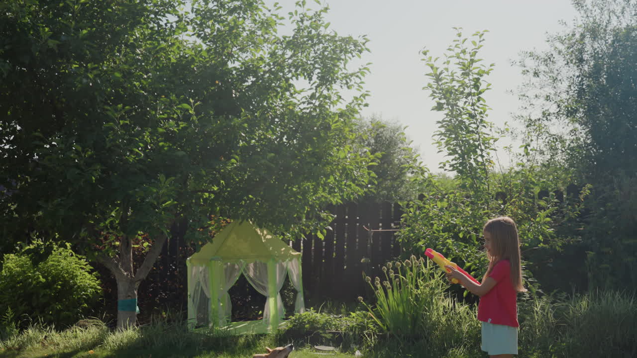 Bright Backyard Play With Girl And Dog, Child And Canine Share Joyful Moments In Vibrant Outdoor Setting, Cheerful Girl And Her Dog Engage In Cheerful Play Amidst Lush Garden Surroundings