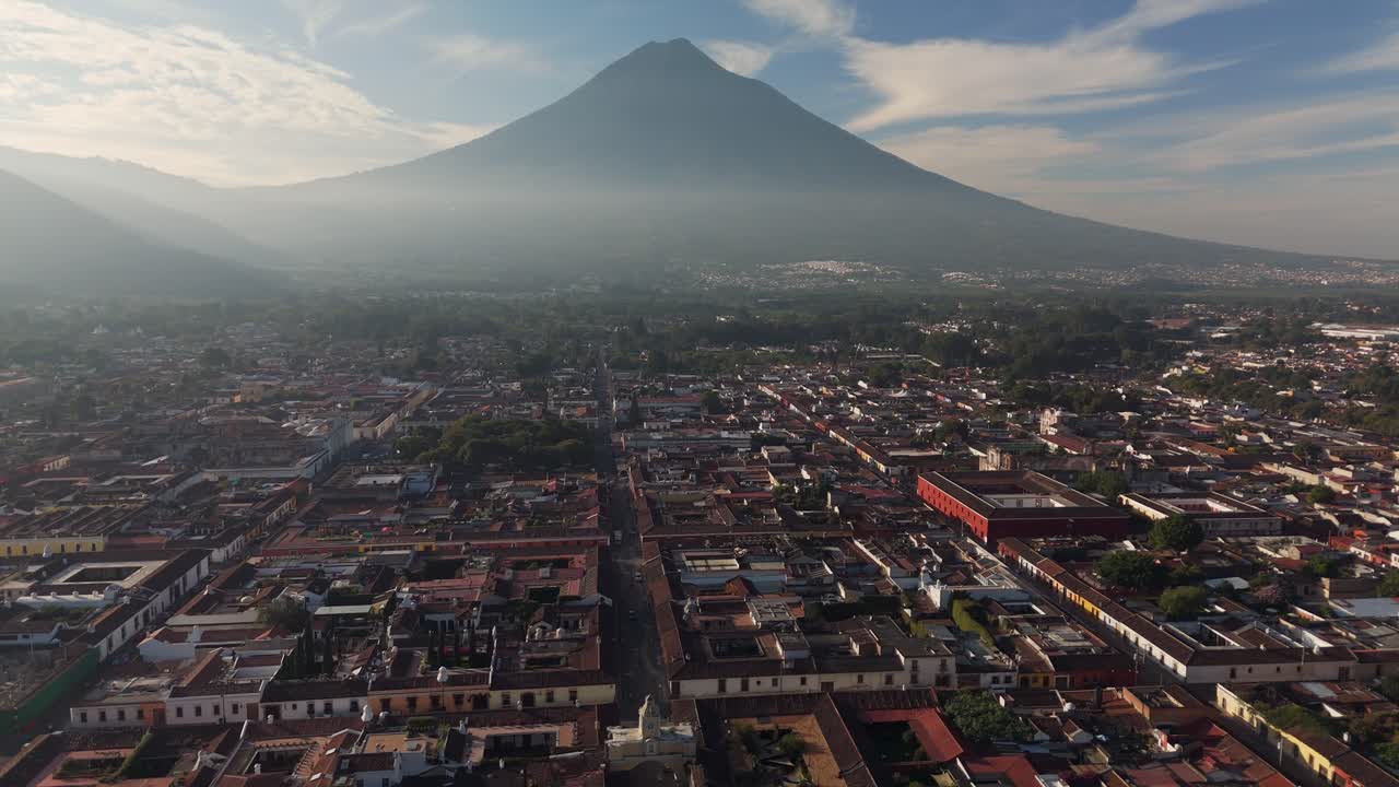 Aerial view of the cityscapes Antigua with Agua volcano on the background, Guatemala