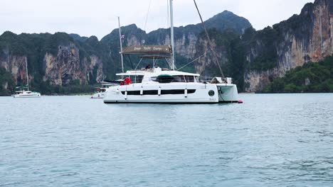 yacht cruising near krabi's scenic cliffs