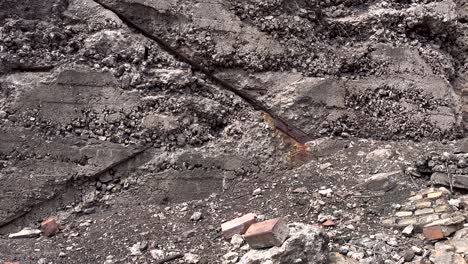 close-up-panning-shot-of-crumbling-old-brick-wall-and-rubble-4k