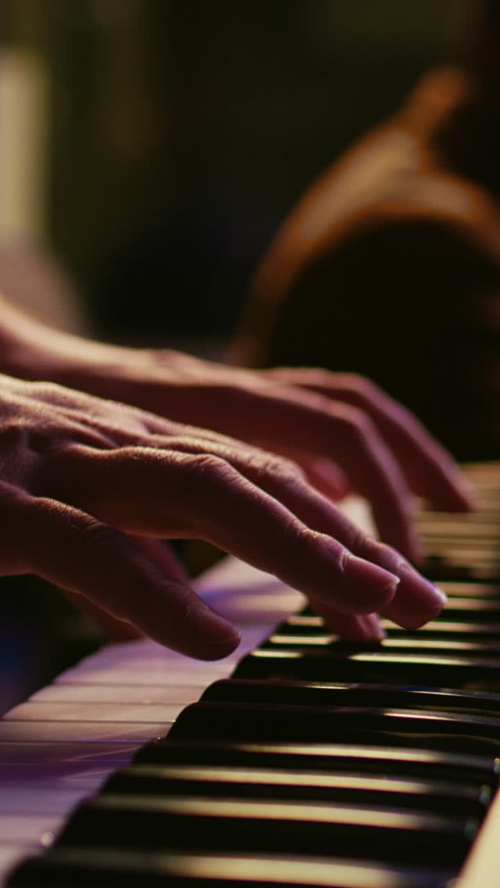 Close-up of Musician's Hands Playing a Keyboard Instrument