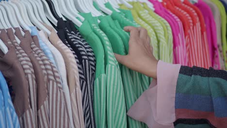 woman shopping for clothes in a clothing store