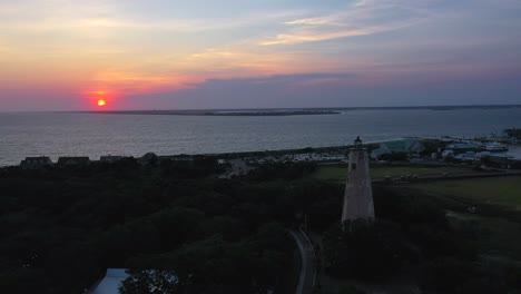 beautiful and colorful sunset over bald head island near old baldy lighthouse