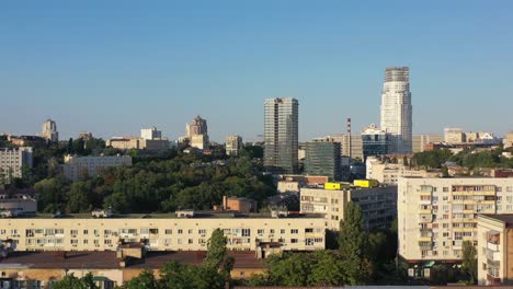 Aerial-drone-video-of-downtown-skyline-buildings-and-cars-on-the-highway-in-Pecherskyi-district-of-Kyiv-Oblast-Ukraine-during-sunset