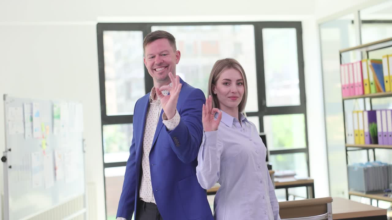 Professional colleagues showing agreement and teamwork in the office