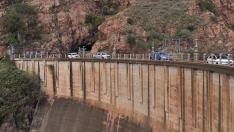 Highway-into-Hartbeespoort,-S-Africa-crosses-over-dam-wall