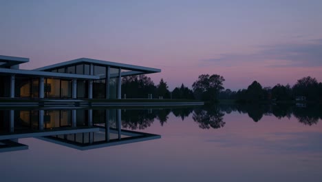 modern lake house at dusk