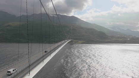 cars traveling on cable stayed suspension halogaland bridge in narvik, norway, aerial