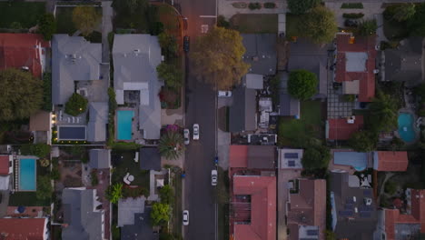 residential los angeles neighborhood as seen from above, aerial drone shot of peaceful suburban street