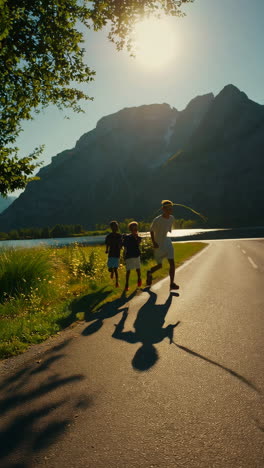 kids running and playing on a scenic road in the mountains