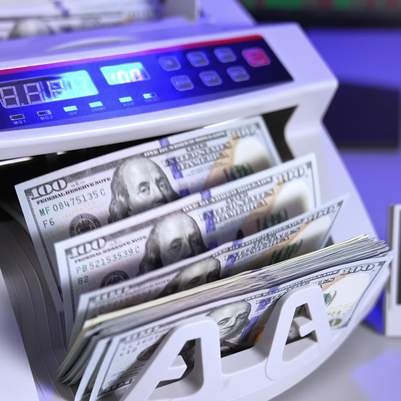 Modern electronic machine. Machine counter automatically calculates a large amount of dollar banknotes. Top view. Business accounting