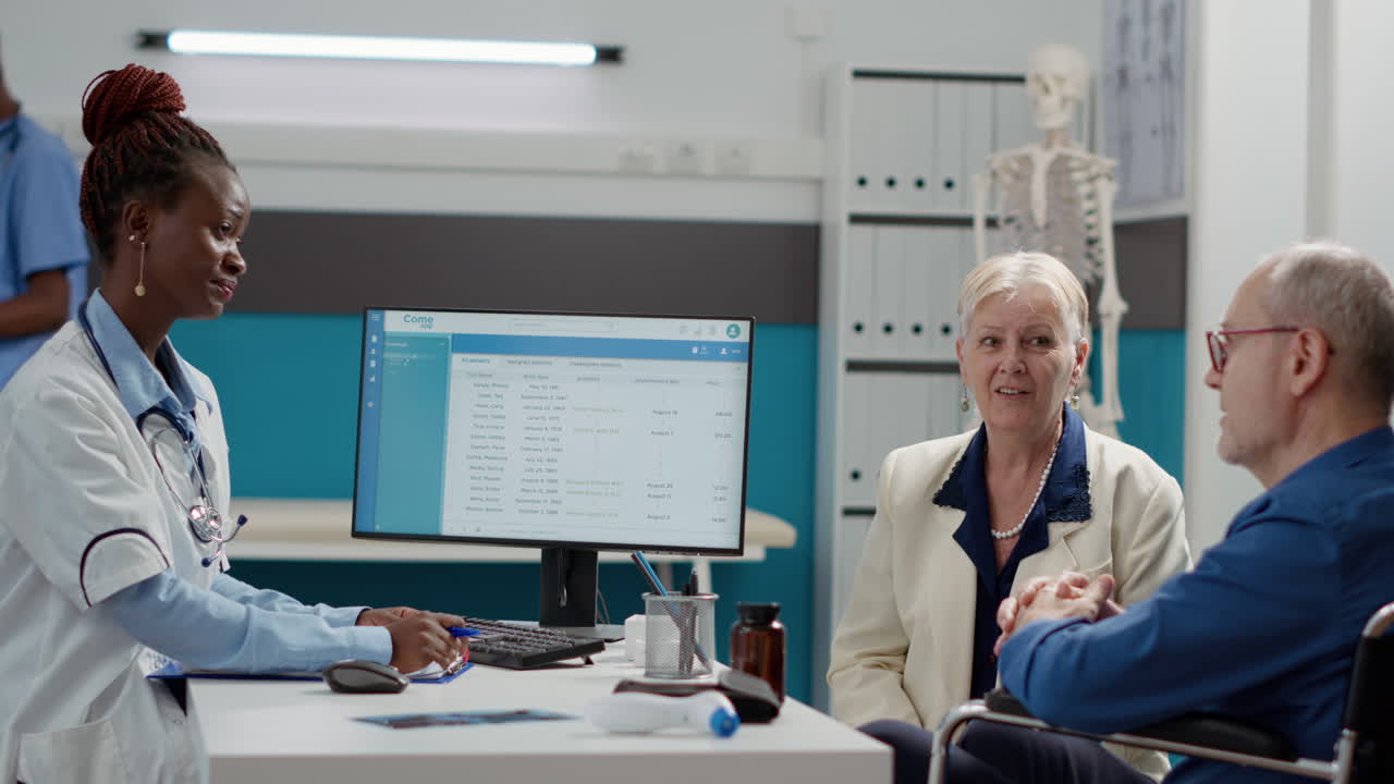 Medical consultation of elderly couple with doctor in clinic