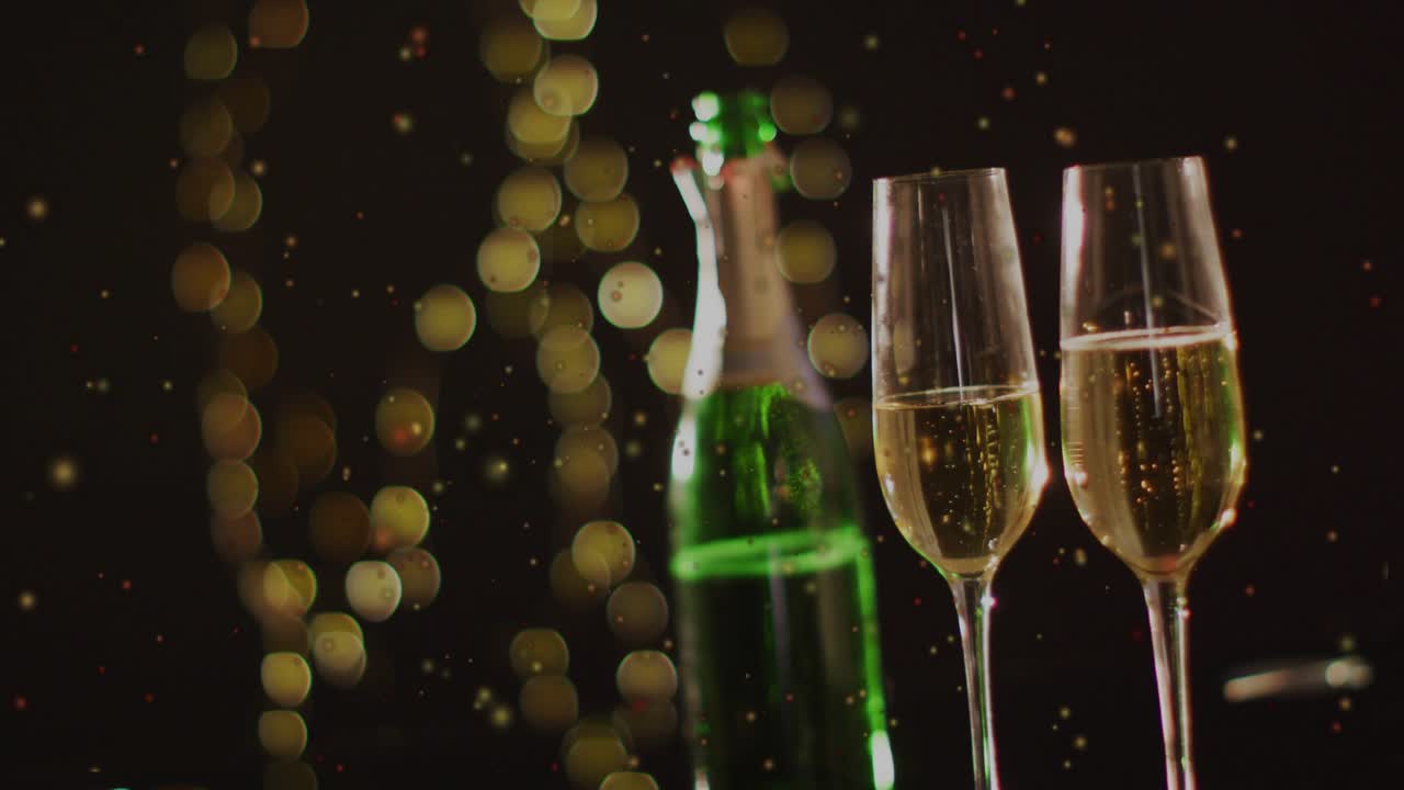 Drifting glitter entering, lifting bubbles in two flutes beside green bottle, conveying party mood