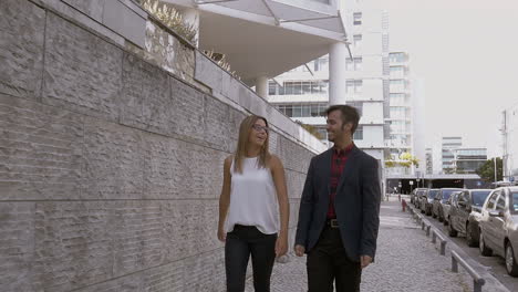 Happy-man-and-woman-walking-on-street