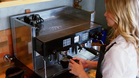 High-angle-view-of-waitress-is-preparing-a-coffee