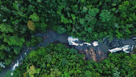 Aerial-shot-of-river-and-many-waterfalls-in-green-forest