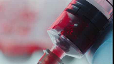 macro of syringe collecting venous blood sample in laboratory