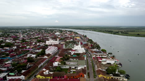 rotational drone shot of the main square and the papaloapan river in tlacotalpan, veracruz, mexico