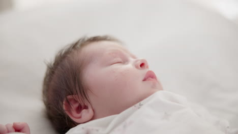 Baby,-face-and-sleeping-in-the-morning-on-nursery