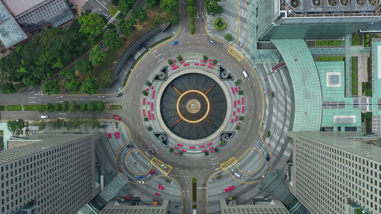 hora del día ciudad de singapur edificios famosos del centro del tráfico círculo cuadrado panorama aéreo 4k