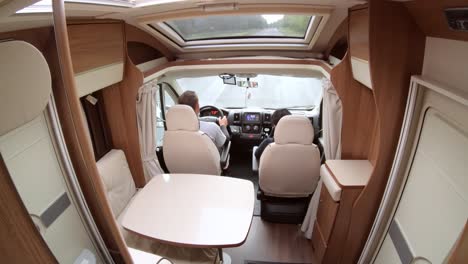 man driving on a road in the camper van rv