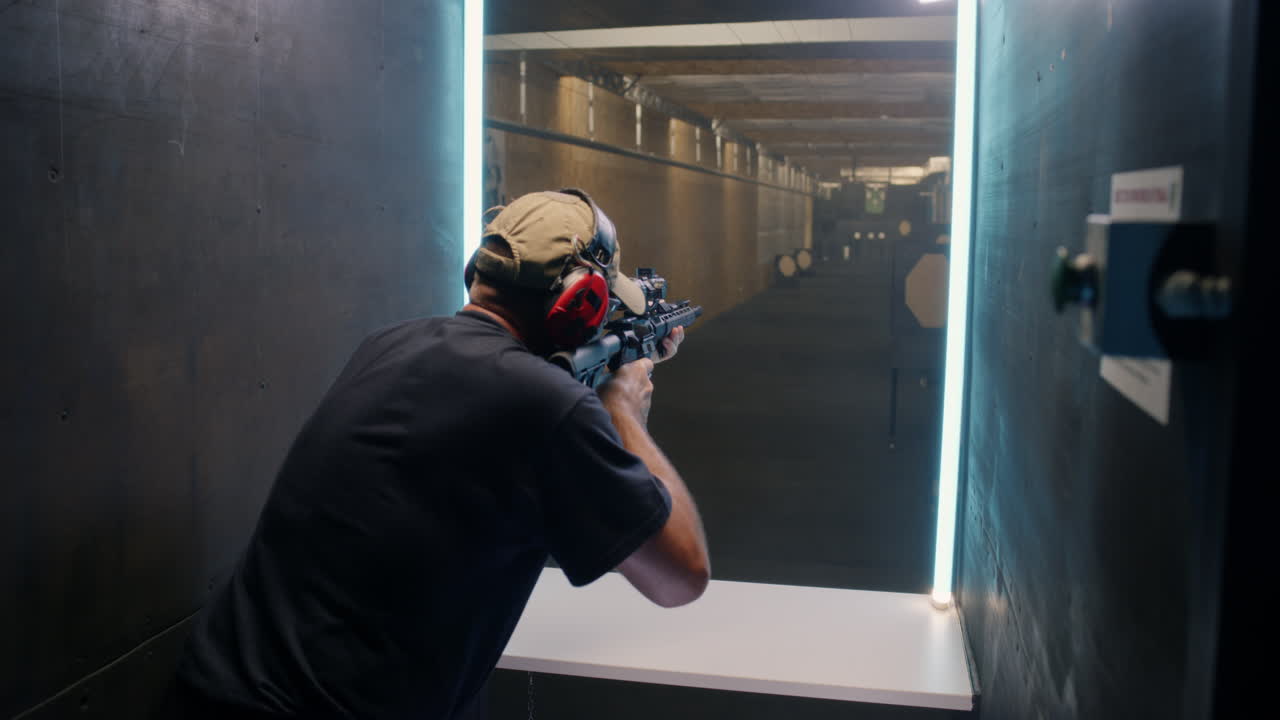 Man Practicing Shooting at a Gun Range