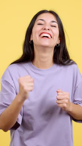 young woman expressing joy and triumph